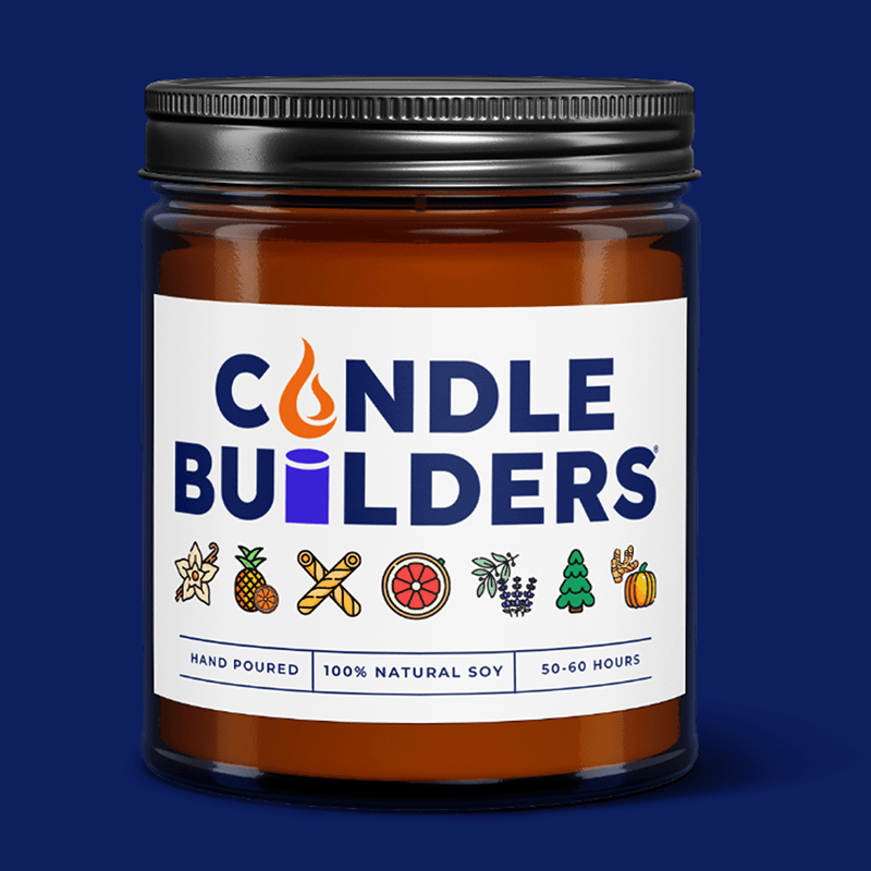 A private label candle on display with a candle builders logo. The candle is in an Amber colored jar with a black lid, one of our most popular candle options. It indicates you can custom make your own candle labels. The candle is placed in a forest environment.