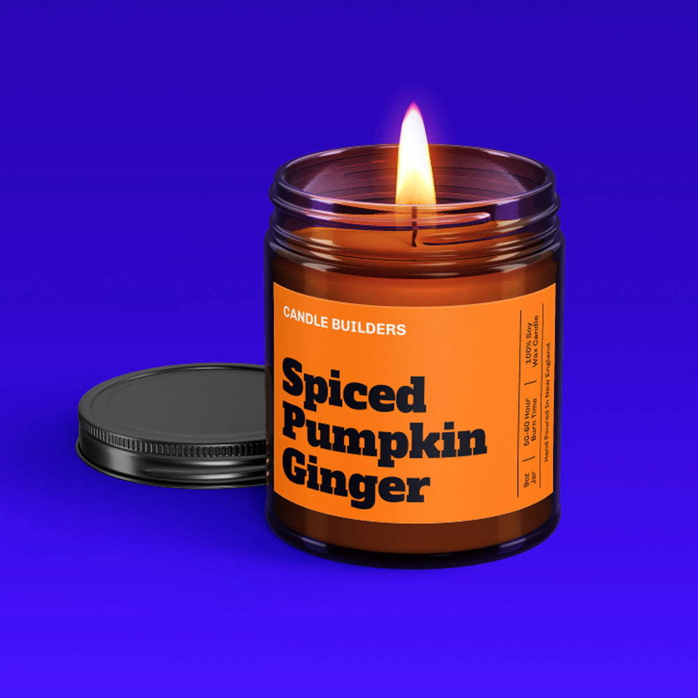 A photo showing a beautiful lit candle in an amber jar with a Spiced pumpkin ginger scent label