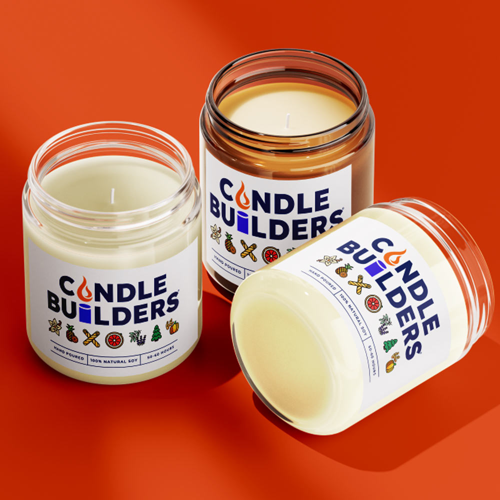 A photo showing 3 different candles with the Candle Builders labels on them. Indicates the variety of jar types, including clear and amber jars.