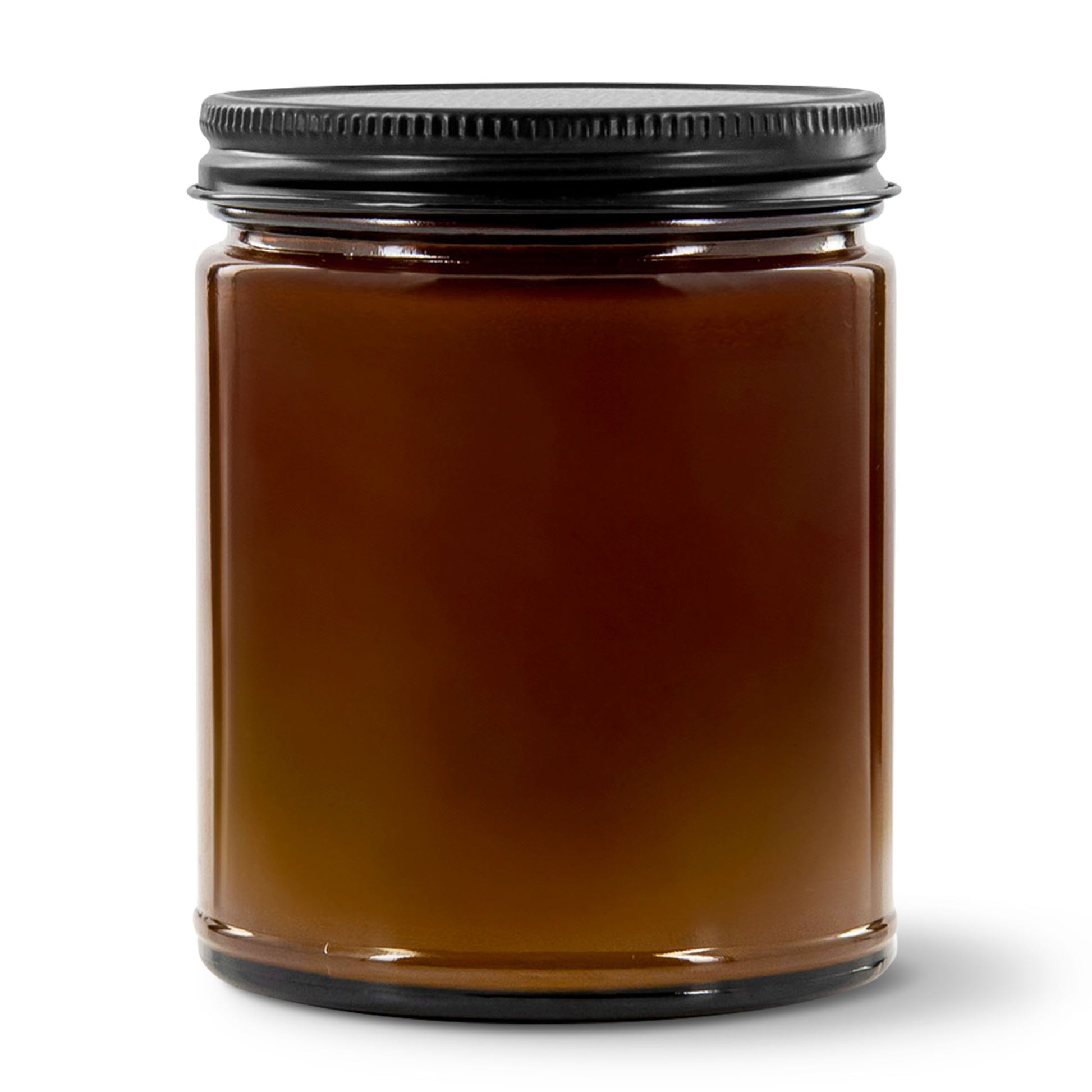Amber glass jar with a black lid on a white background