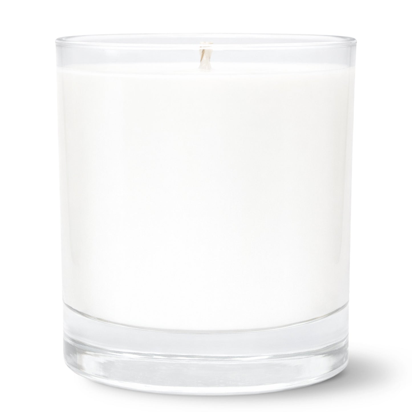 11oz Clear glass tumbler candle on white background. Candle doubles as a ricks glass for whiskey or bourbon and has a thick base.