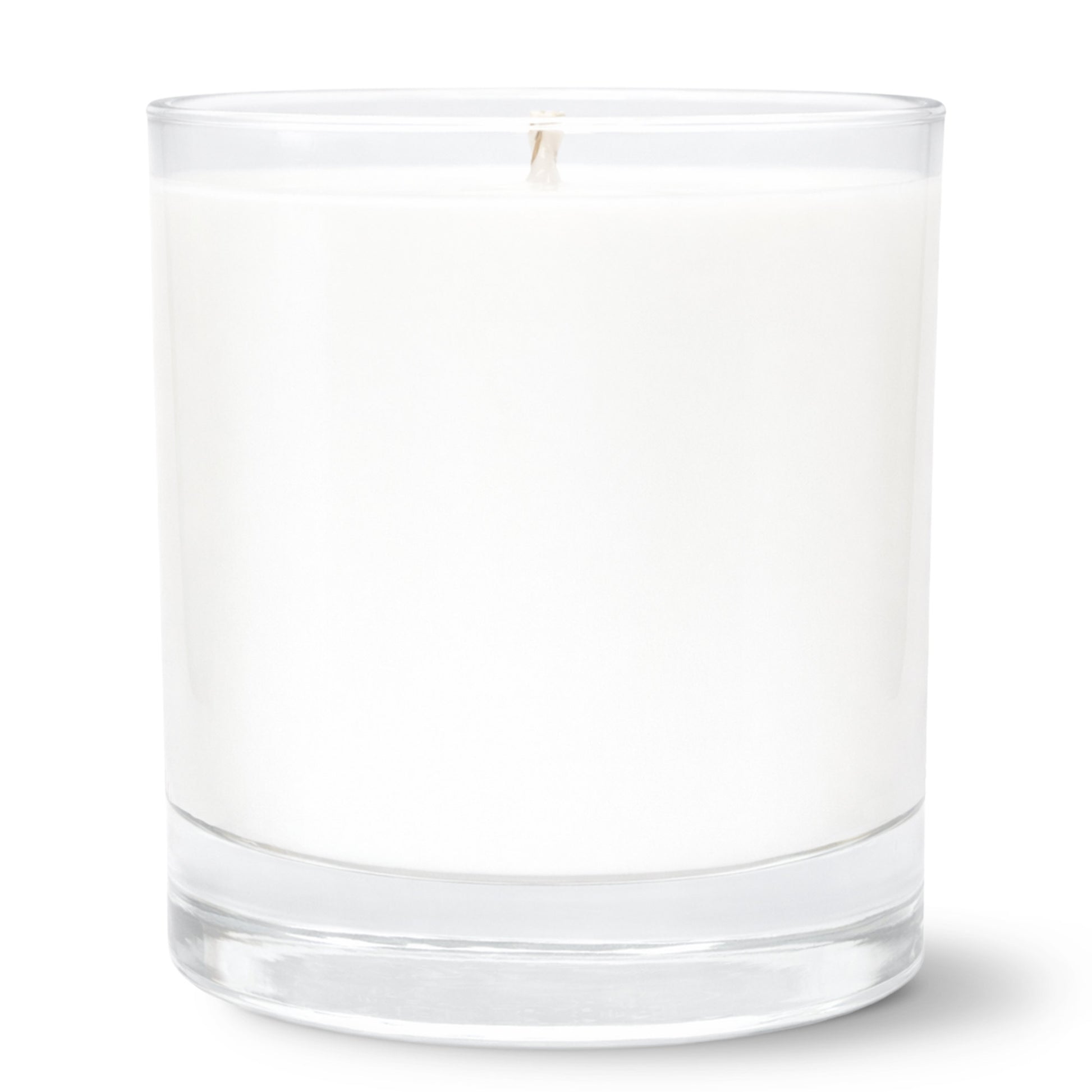 11oz Clear glass tumbler candle on white background. Candle doubles as a ricks glass for whiskey or bourbon and has a thick base.