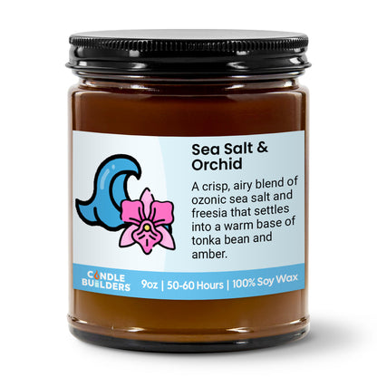 Jar of candle labeled 'Sea Salt & Orchid' with a wave and flower design on a white background